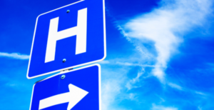 critical access hospital requirements​ represented by blue hospital highway sign