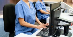 UB-04 Software RCM Integration and EHR Billing for RHCs represented by nurse at computer