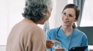 female NP discussing connect care with a patient