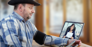 Man using connected care to have his blood pressure checked remotely