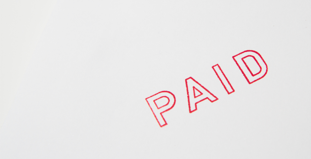 red "paid" stamp on white background to represent best practices to reduce claim denials in healthcare​