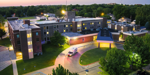 Photo of William Newton Hospital at night